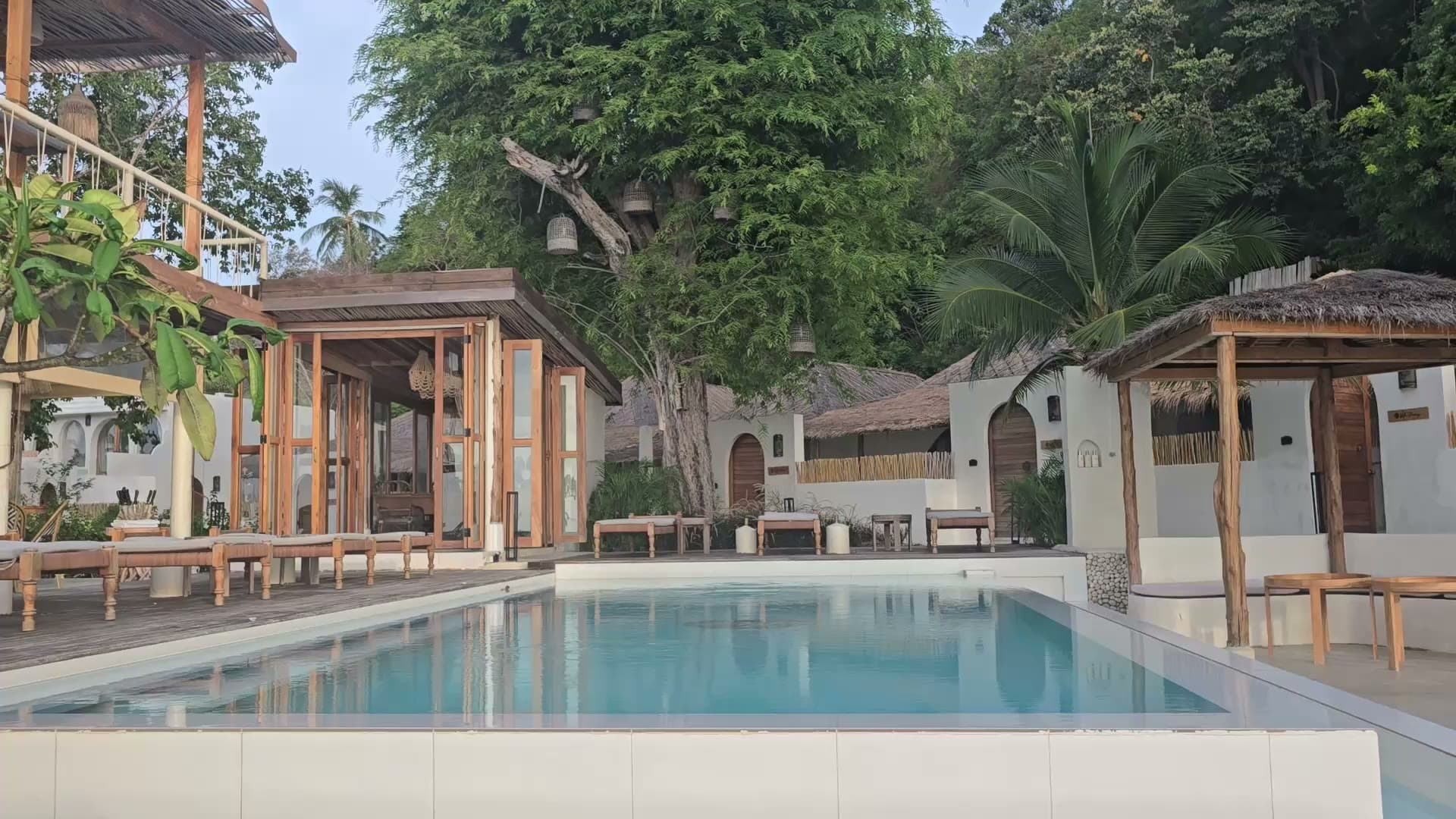 Cape Beach Villa — sunbeds and terrace by the sandy beach, golden hour