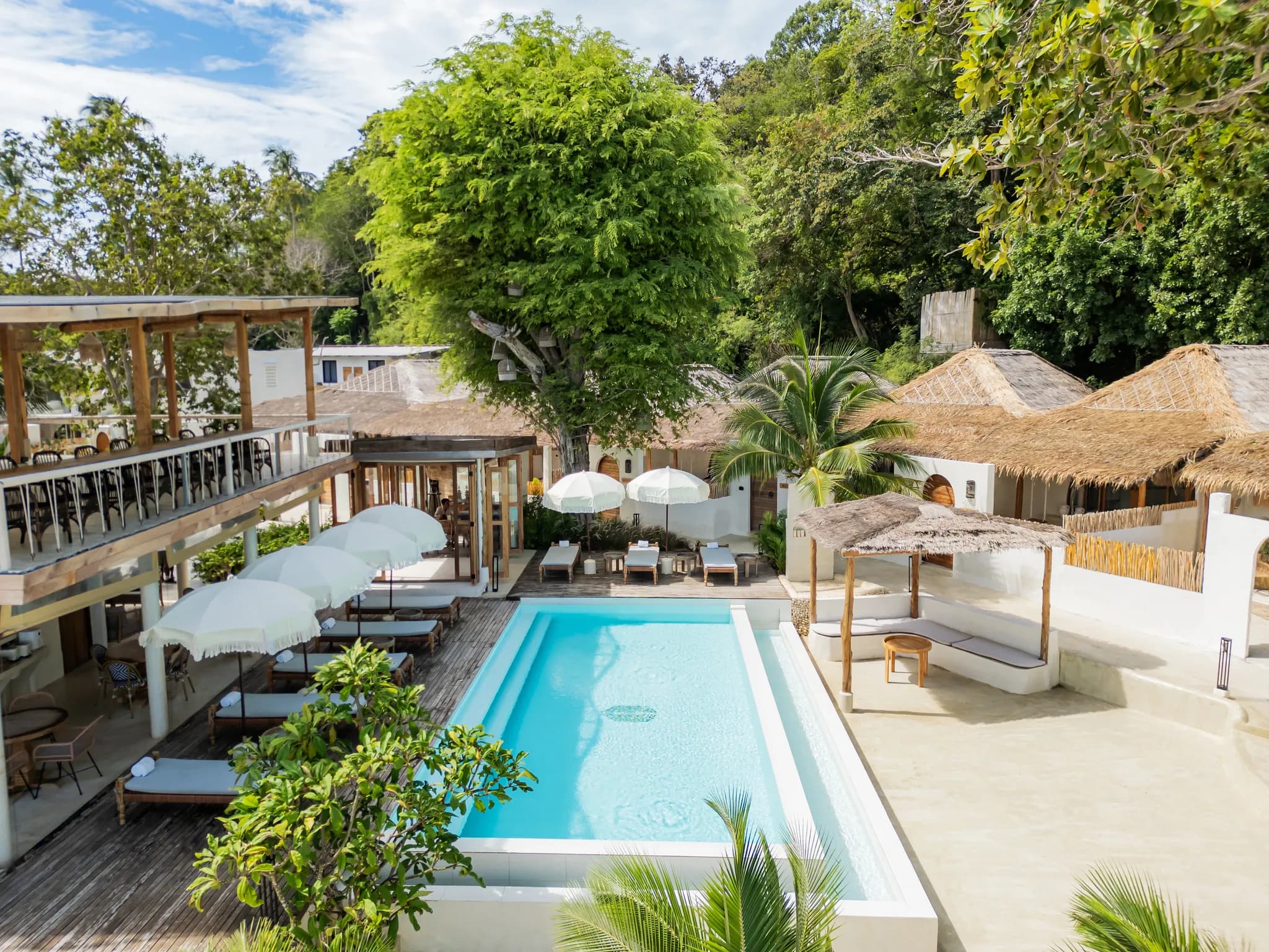 The shared sea-view pool and calm, safe-swimming sandy beach at Cape Beach Villa, Koh Samui