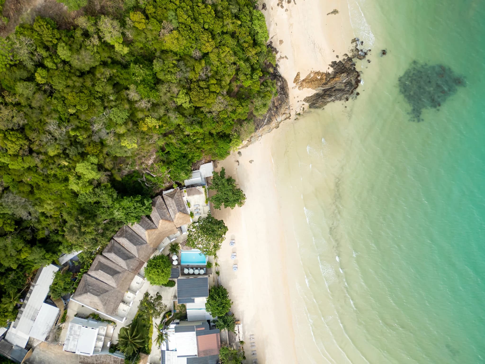 Kayaks and the shared sea-view pool by a calm, safe-swimming sandy beach at Cape Beach Villa, Koh Samui
