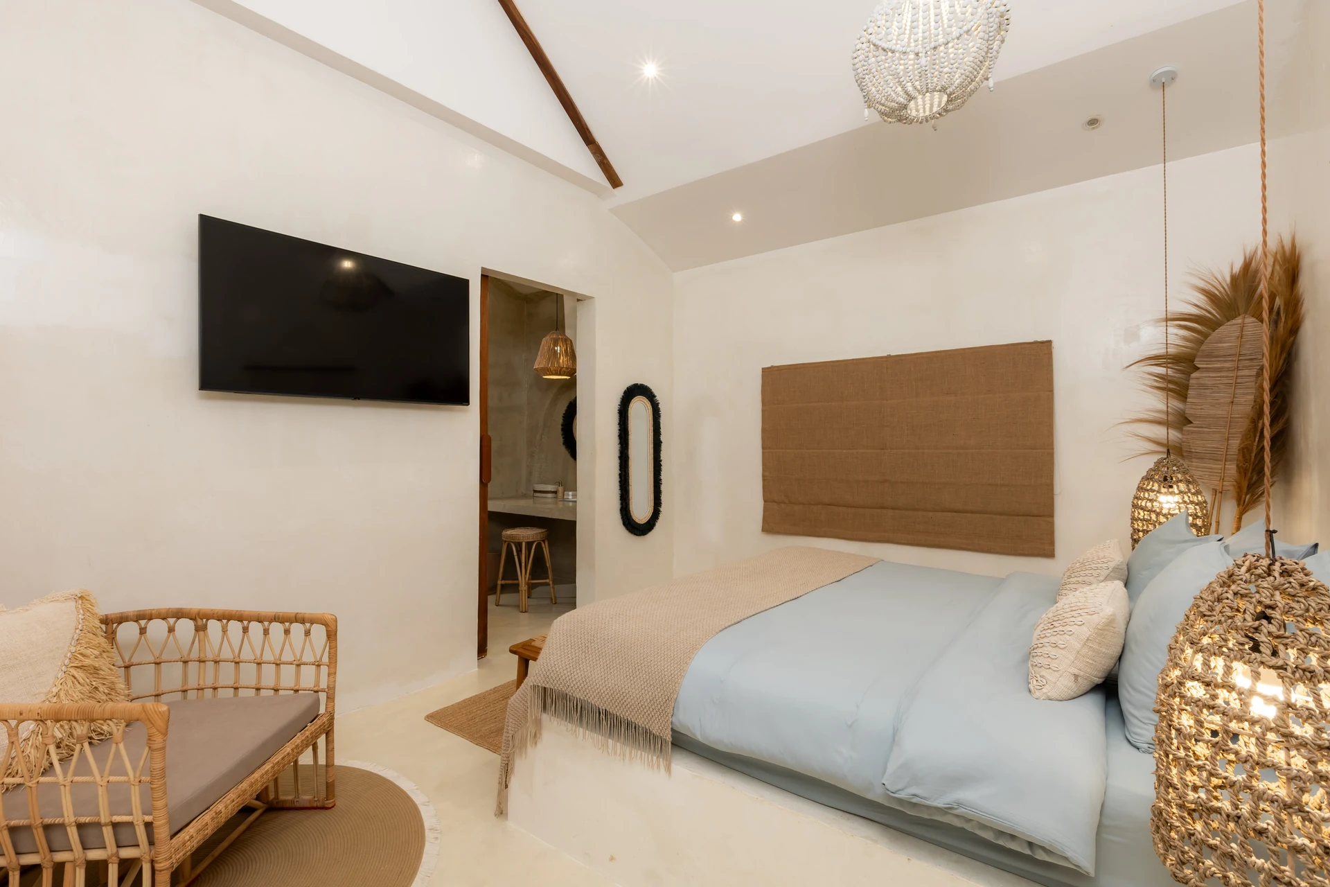 Comfort Villa — boho living room with rattan seating (Villa Ginger) — photo 10