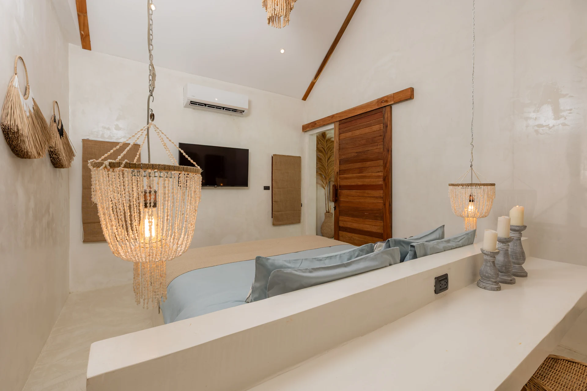 Comfort Villa — boho living room with rattan seating (Villa Ginger) — photo 14