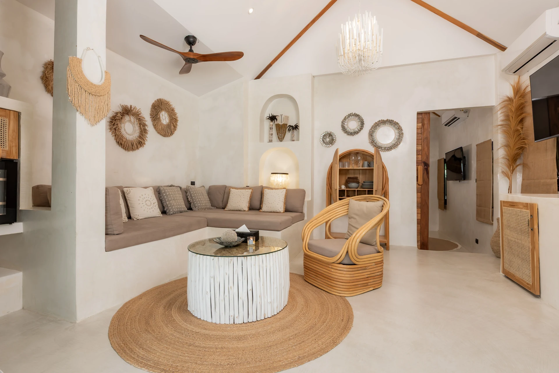 Comfort Villa — boho living room with rattan seating (Villa Ginger) — photo 15