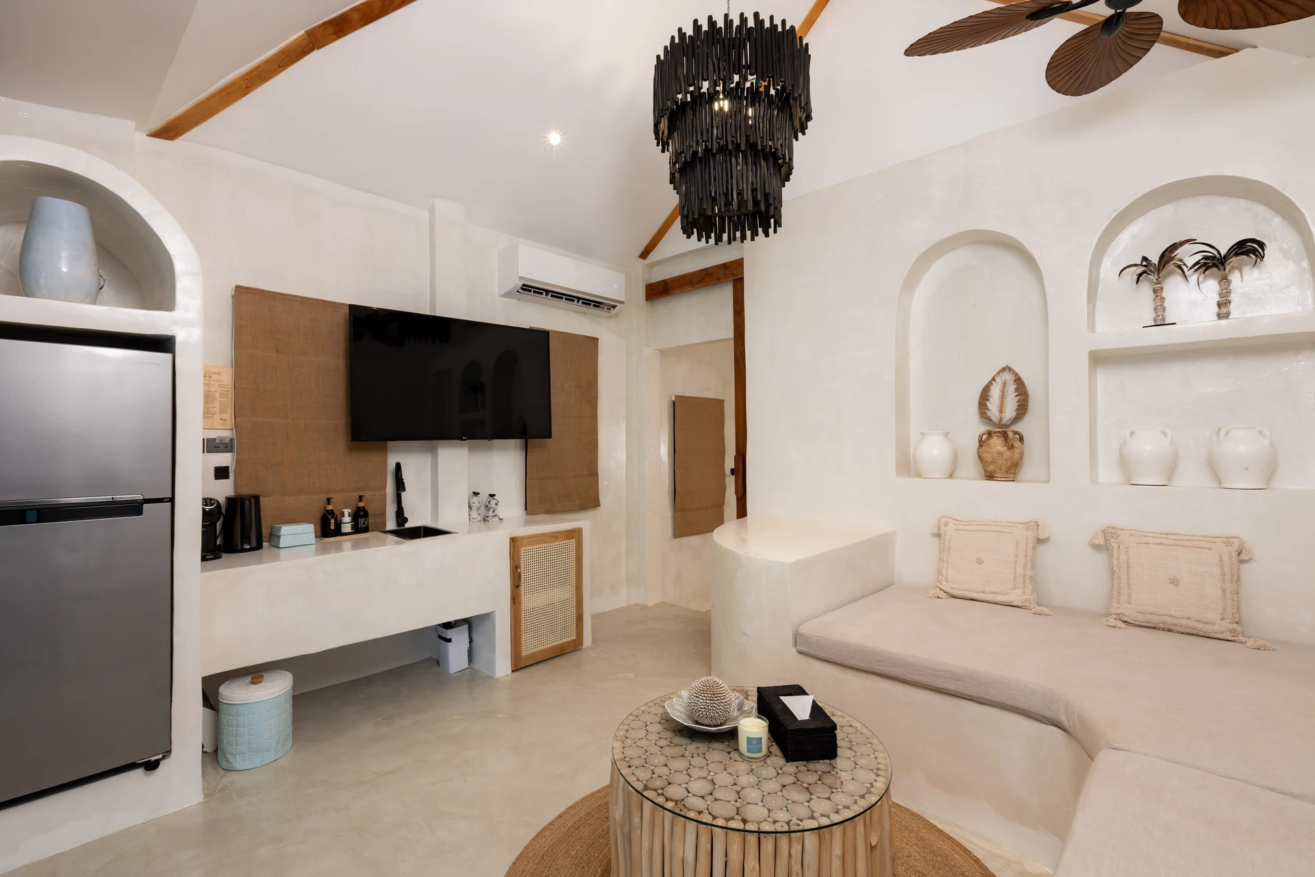 Comfort Villa — boho living room with rattan seating (Villa Ginger) — photo 21