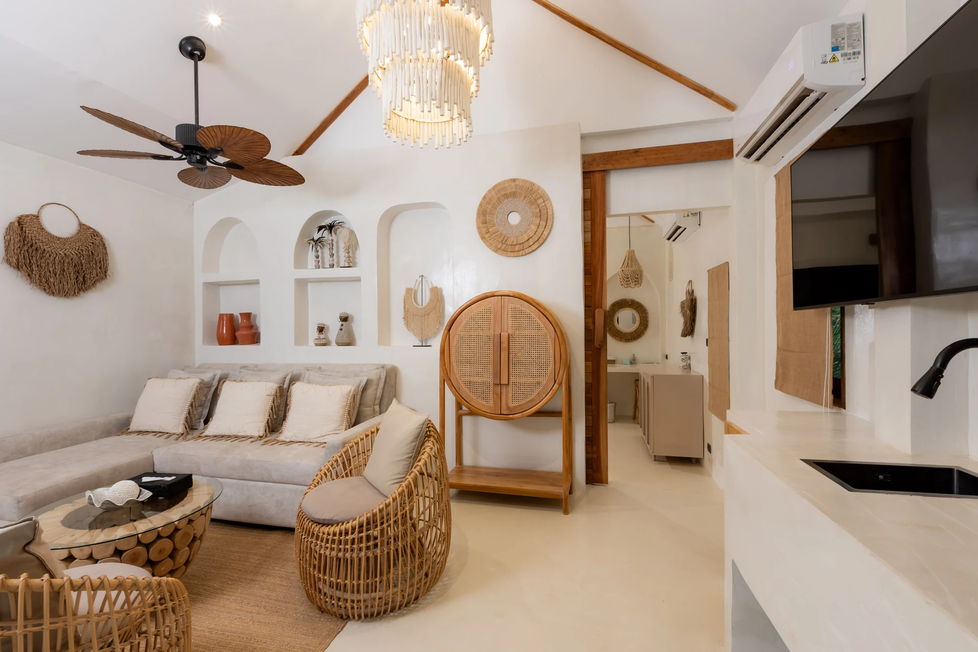 Comfort Villa — boho living room with rattan seating (Villa Ginger) — photo 23