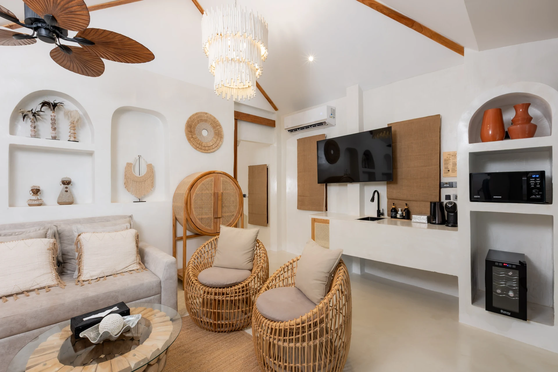 Comfort Villa — boho living room with rattan seating (Villa Ginger) — photo 24