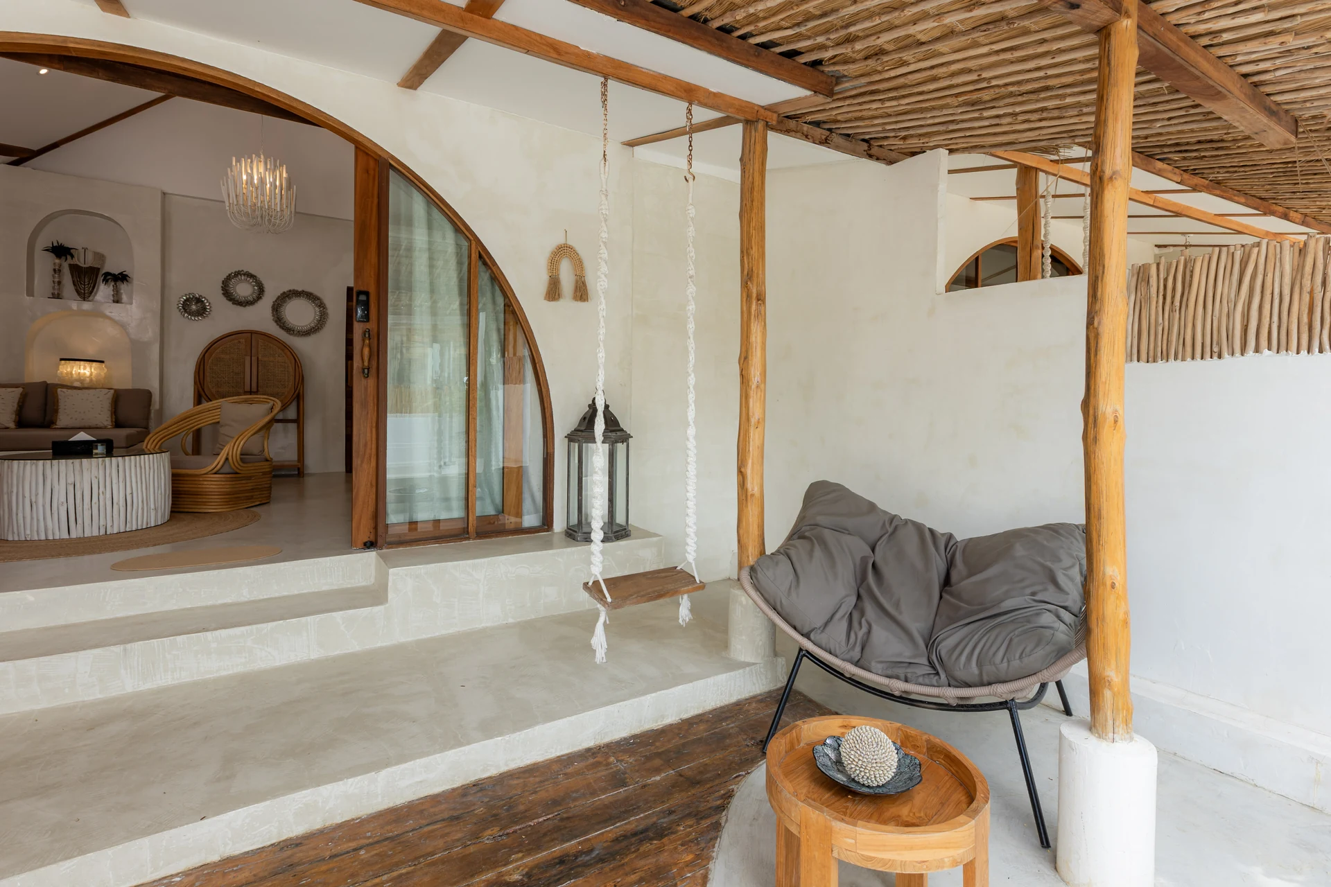 Comfort Villa — boho living room with rattan seating (Villa Ginger) — photo 26